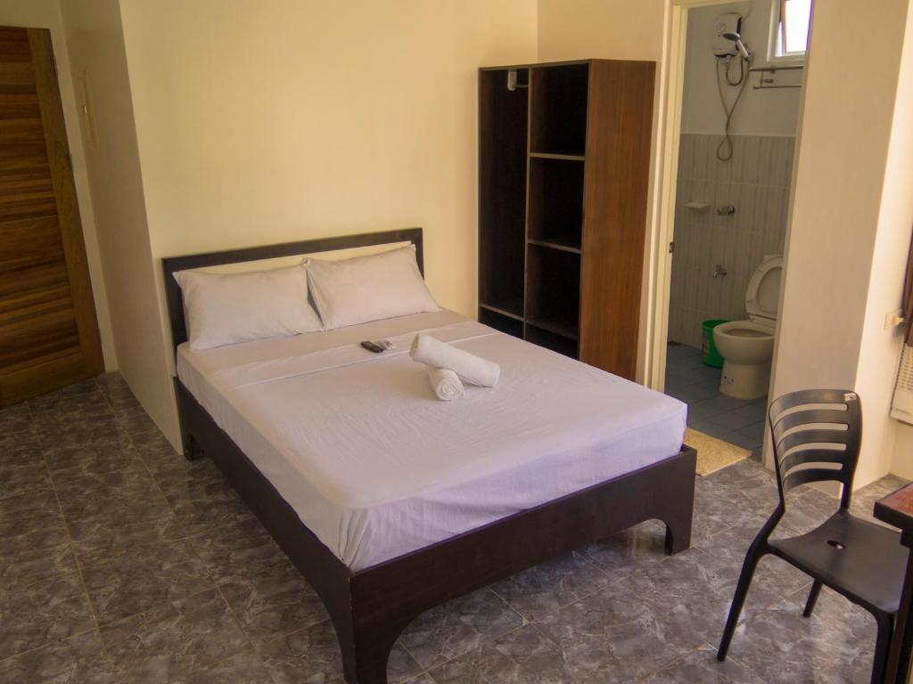 Postel nebo postele na pokoji v ubytování Cool Stay Inn