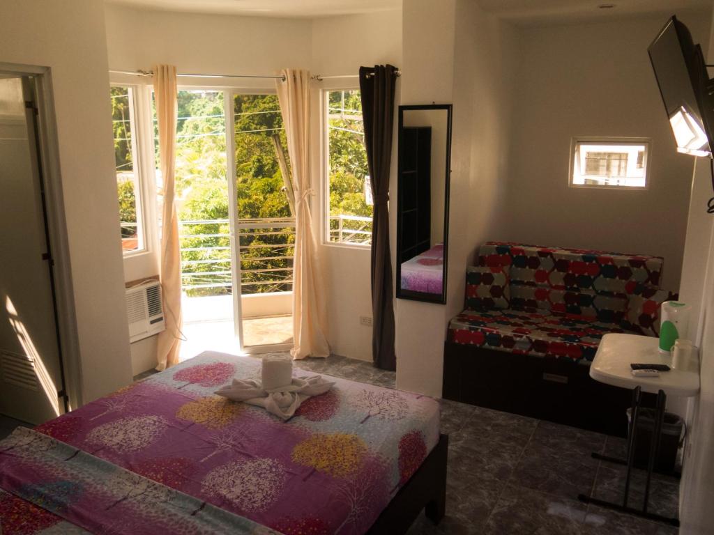 Postel nebo postele na pokoji v ubytování Cool Stay Inn