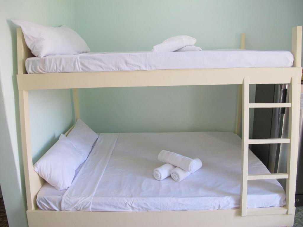 Postel nebo postele na pokoji v ubytování Cool Stay Inn