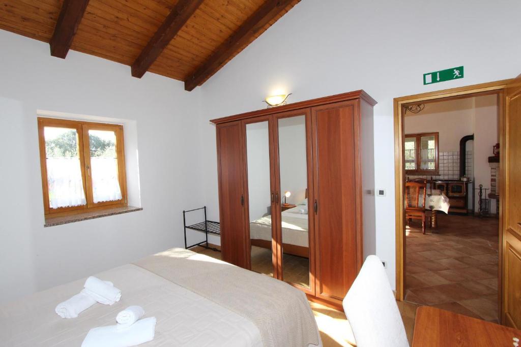 Postel nebo postele na pokoji v ubytování Holiday House San Pruti
