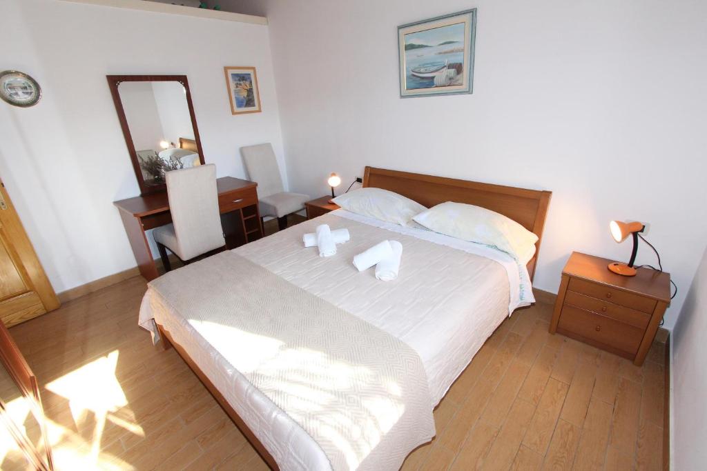 Postel nebo postele na pokoji v ubytování Holiday House San Pruti