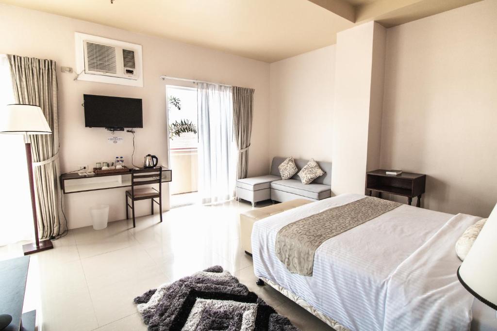 Postel nebo postele na pokoji v ubytování Sierra Hotel