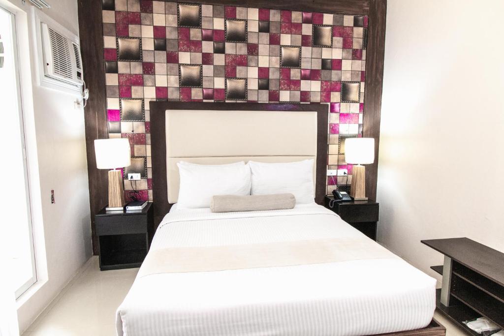 Postel nebo postele na pokoji v ubytování Sierra Hotel