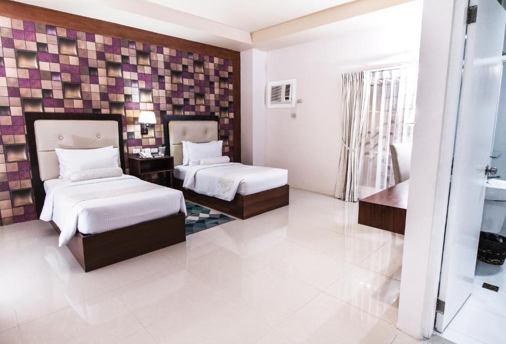 Postel nebo postele na pokoji v ubytování Sierra Hotel