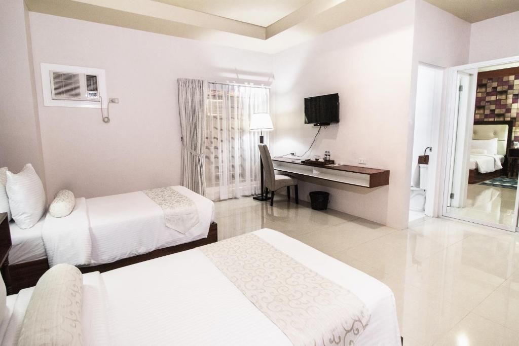 Postel nebo postele na pokoji v ubytování Sierra Hotel