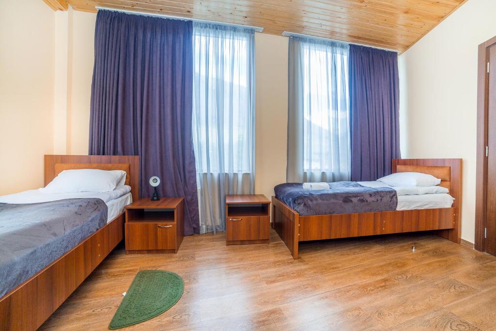 Postel nebo postele na pokoji v ubytování hotel Gallery
