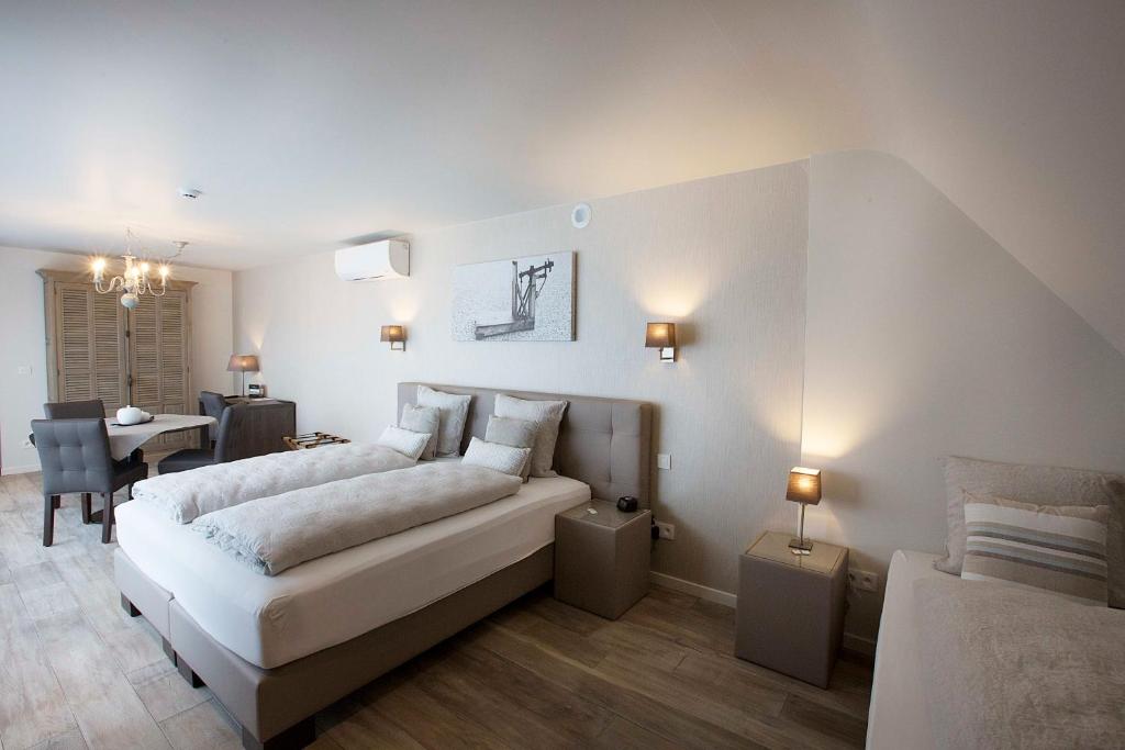 Postel nebo postele na pokoji v ubytování B&B 't Meesterhof