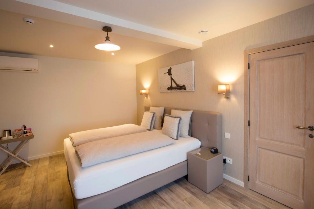 Postel nebo postele na pokoji v ubytování B&B 't Meesterhof