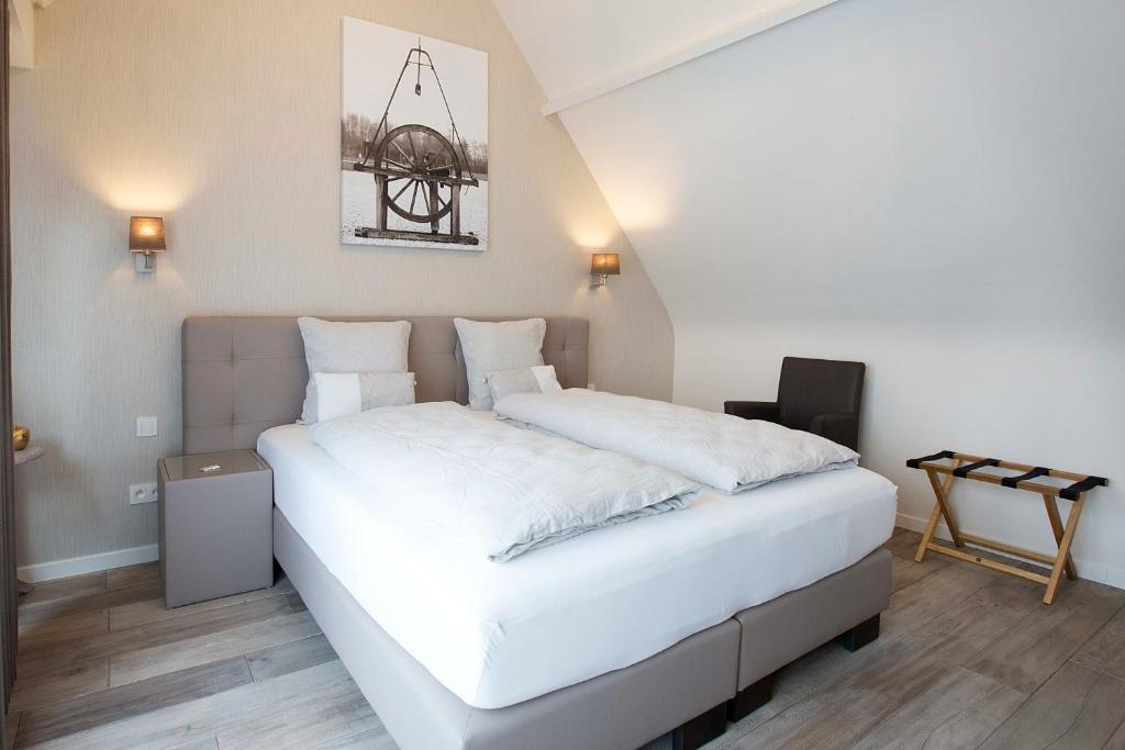 Postel nebo postele na pokoji v ubytování B&B 't Meesterhof