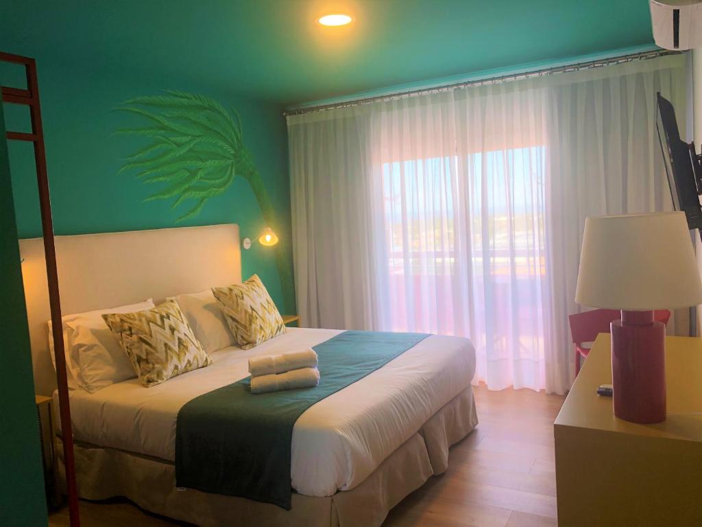 Postel nebo postele na pokoji v ubytování Hotel Ritual Maspalomas - Adults Only