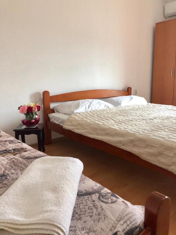 Postel nebo postele na pokoji v ubytování Lazorja Rooms
