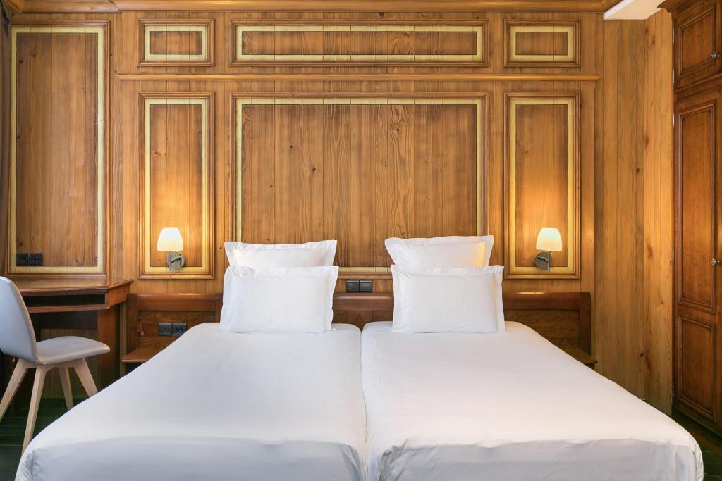 Postel nebo postele na pokoji v ubytování Hôtel de l'Europe by HappyCulture