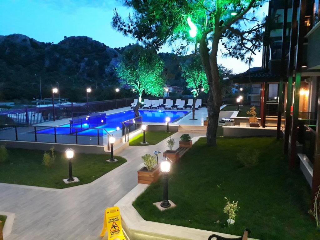 a view of a swimming pool at night at THE SARIGERME INN in Sarigerme