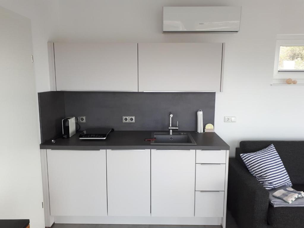 Kuchyň nebo kuchyňský kout v ubytování Appartement Hareter