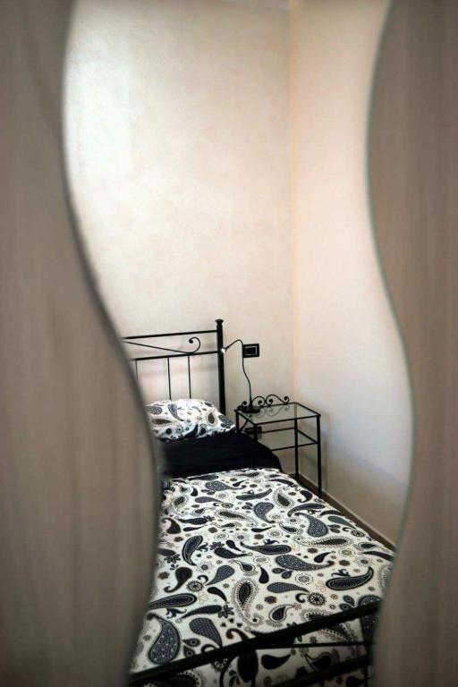 Postel nebo postele na pokoji v ubytování B&B Passalacqua