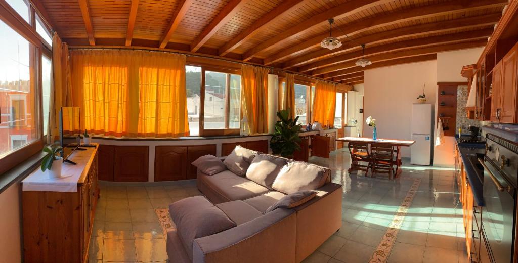 a large living room with a couch and a table at Casa Luna in Lipari