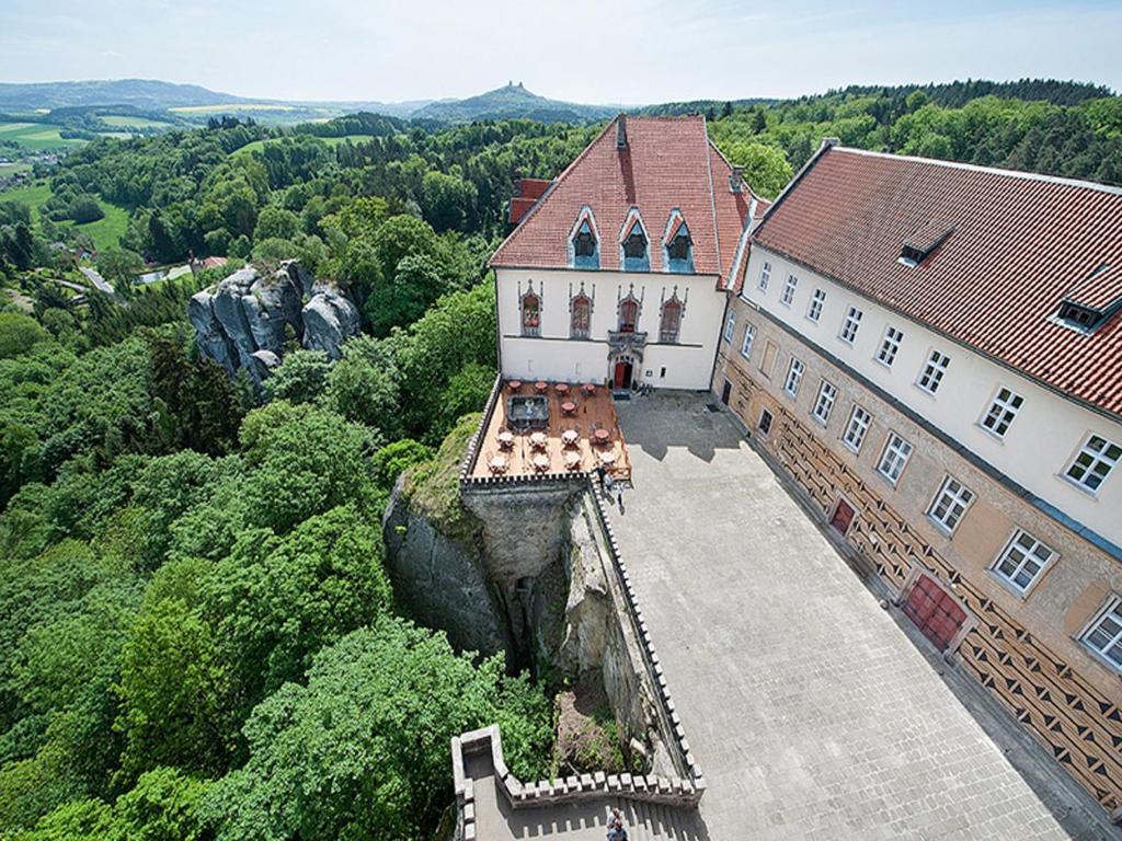 an aerial view of a large building with trees at EA Hotel Hrubá Skála in Hrubá Skála