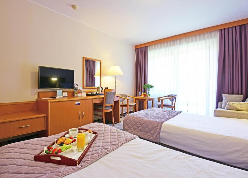 Posteľ alebo postele v izbe v ubytovaní Hotel Mrągowo Resort&Spa