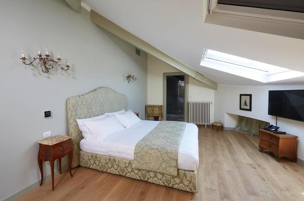 Postel nebo postele na pokoji v ubytování Villa Platamone
