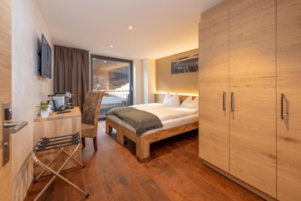 Postel nebo postele na pokoji v ubytování Hotel Heimatlodge