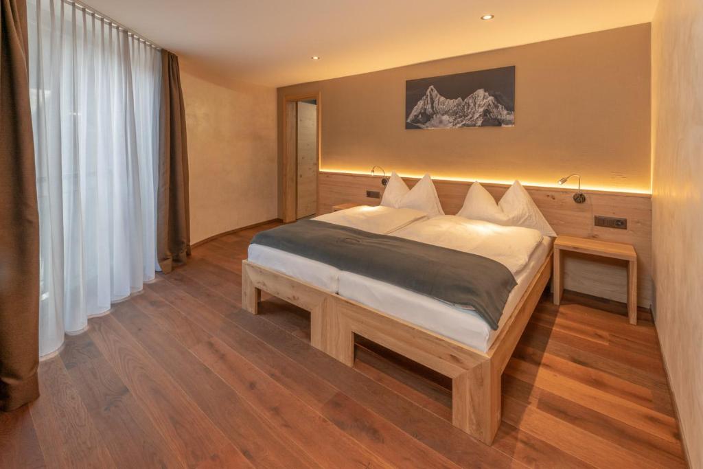 Postel nebo postele na pokoji v ubytování Hotel Heimatlodge