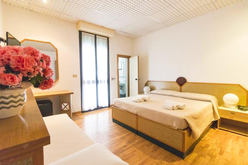 Postel nebo postele na pokoji v ubytování Albergo Palazzo