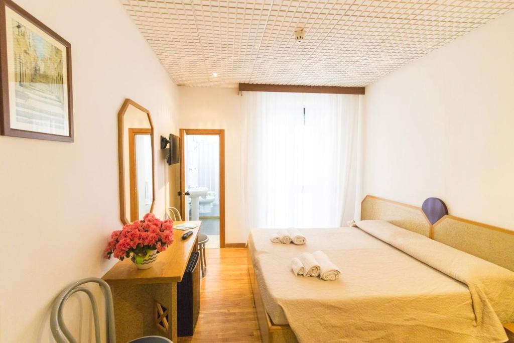 Postel nebo postele na pokoji v ubytování Albergo Palazzo