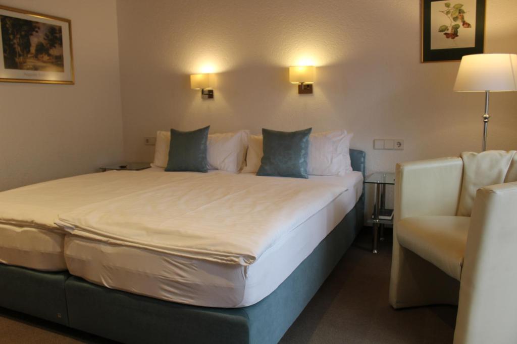 Postel nebo postele na pokoji v ubytování Hotel Rebstock