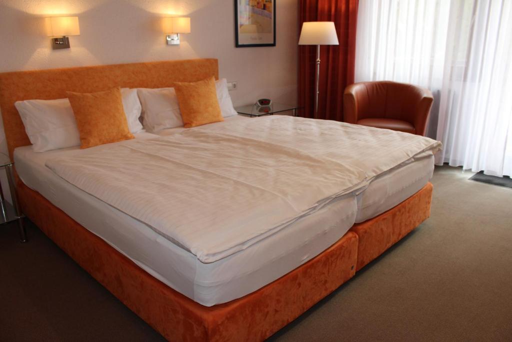 Postel nebo postele na pokoji v ubytování Hotel Rebstock