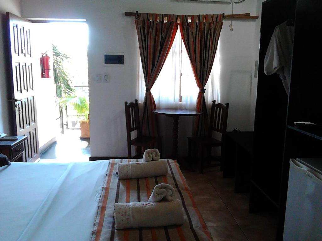 Postel nebo postele na pokoji v ubytování Si Mi Capitán - Cabañas & Habitaciones