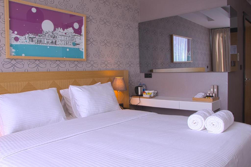 Postel nebo postele na pokoji v ubytování Four-G Hotel