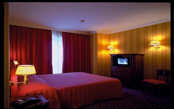 Postel nebo postele na pokoji v ubytování Hotel Federico II