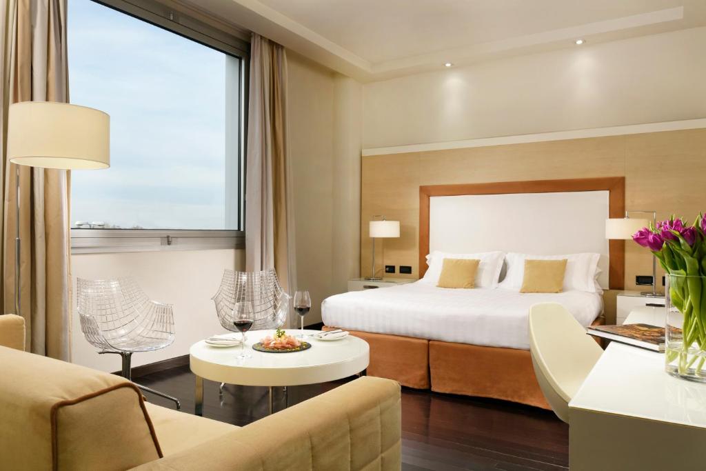 Postel nebo postele na pokoji v ubytování Hotel La Favorita