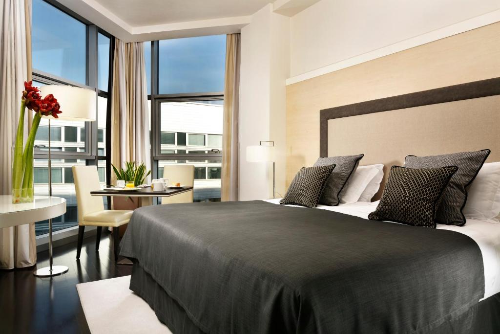 Postel nebo postele na pokoji v ubytování Hotel La Favorita