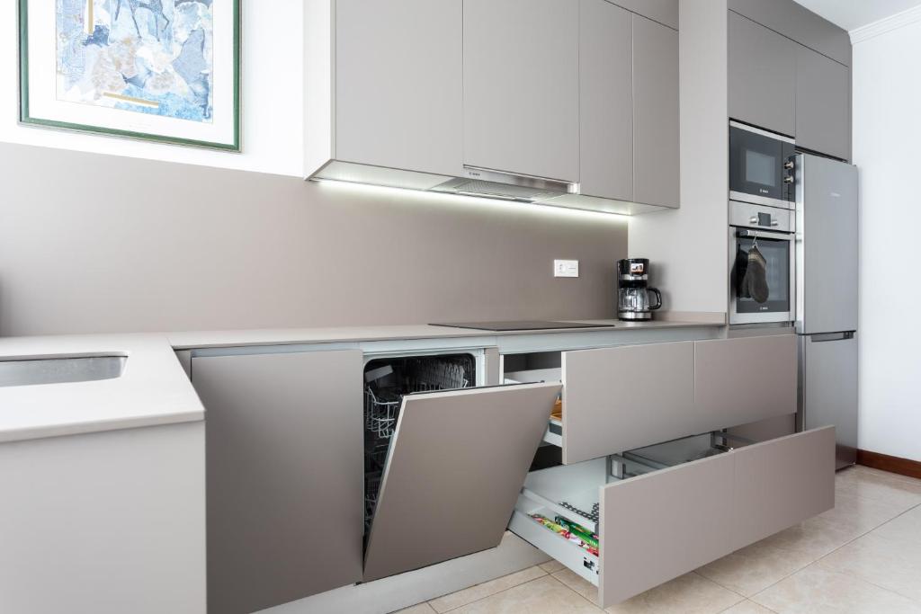 Kuchyň nebo kuchyňský kout v ubytování Rooms & Suites Balcony 3C