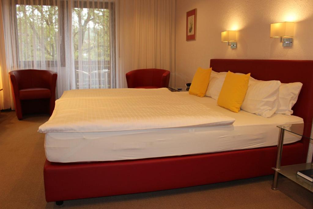 Postel nebo postele na pokoji v ubytování Hotel Rebstock