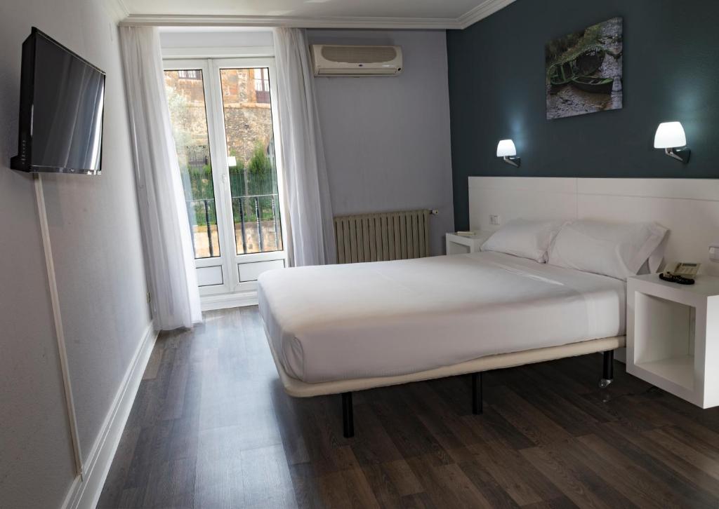 Postel nebo postele na pokoji v ubytování Hotel Gran Regente