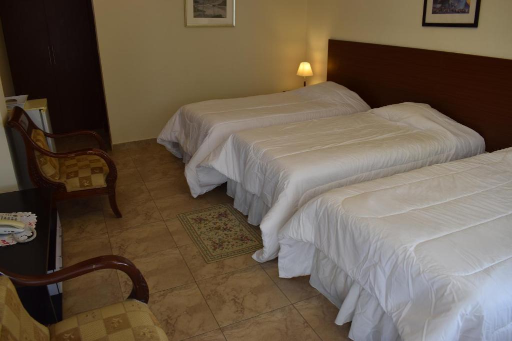 Postel nebo postele na pokoji v ubytování Hosteria Palmetto