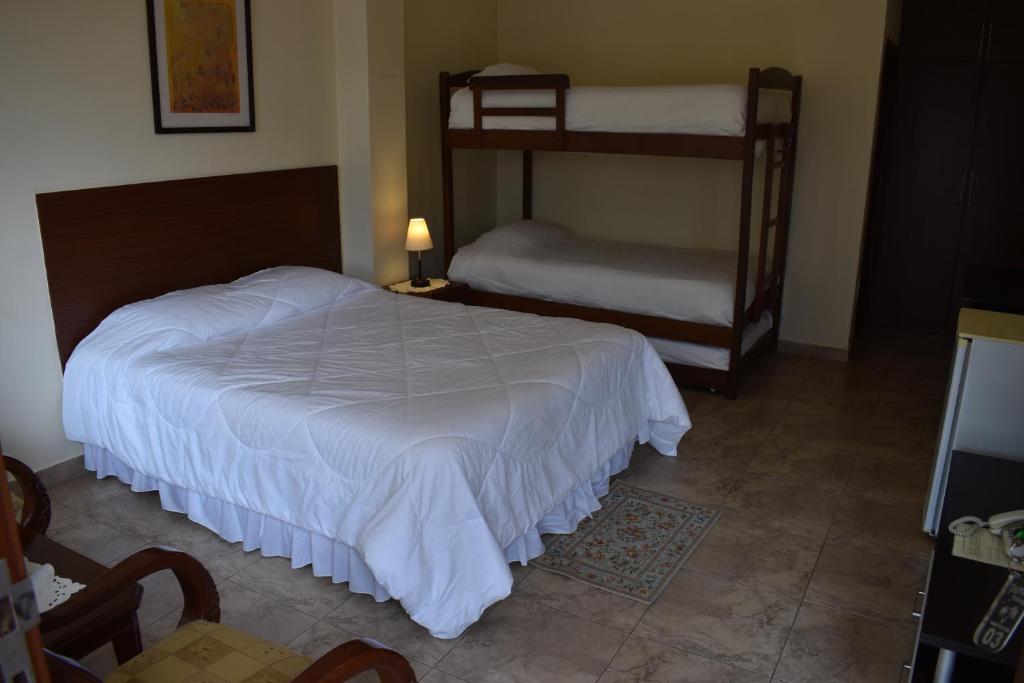 Postel nebo postele na pokoji v ubytování Hosteria Palmetto