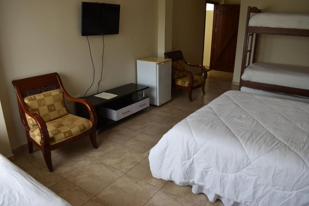 Postel nebo postele na pokoji v ubytování Hosteria Palmetto