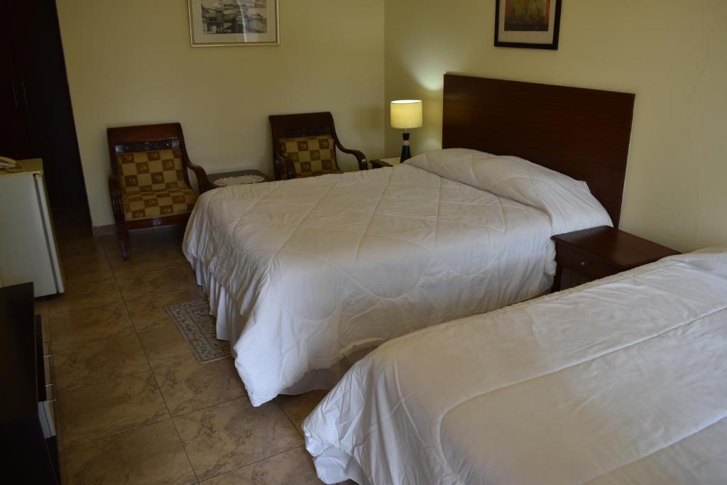 Postel nebo postele na pokoji v ubytování Hosteria Palmetto