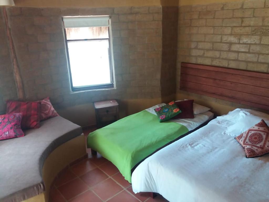 Voodi või voodid majutusasutuse Chalets Sol Muisca RNT85322 toas