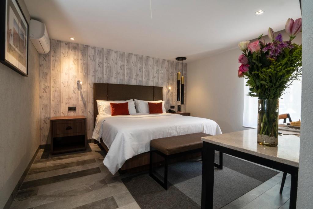 Postel nebo postele na pokoji v ubytování Hotel Ronda Minerva