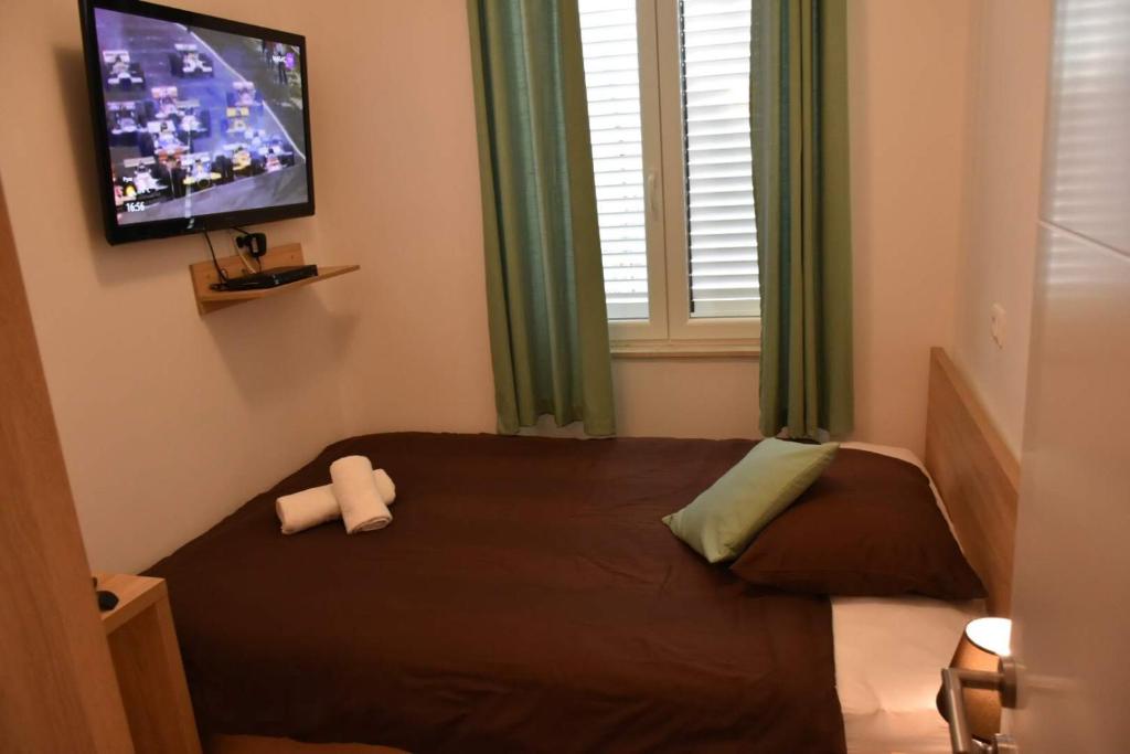 Posteľ alebo postele v izbe v ubytovaní Apartment Baćo