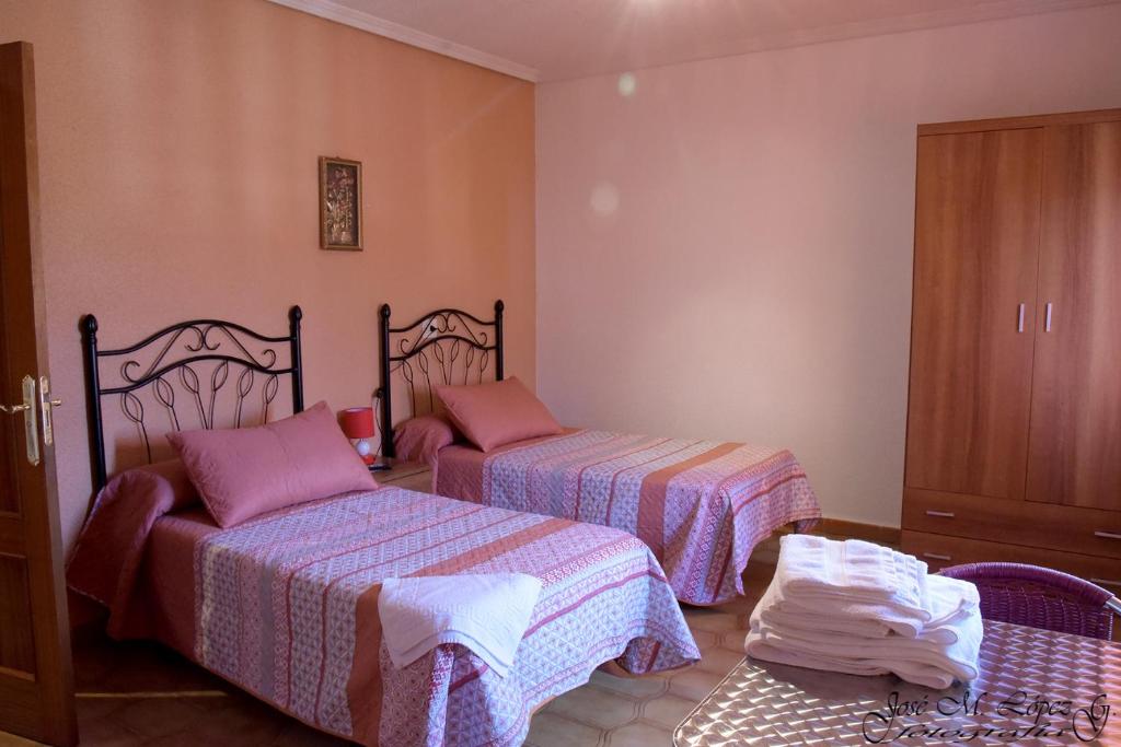 Postel nebo postele na pokoji v ubytování Hostal Restaurante El Final