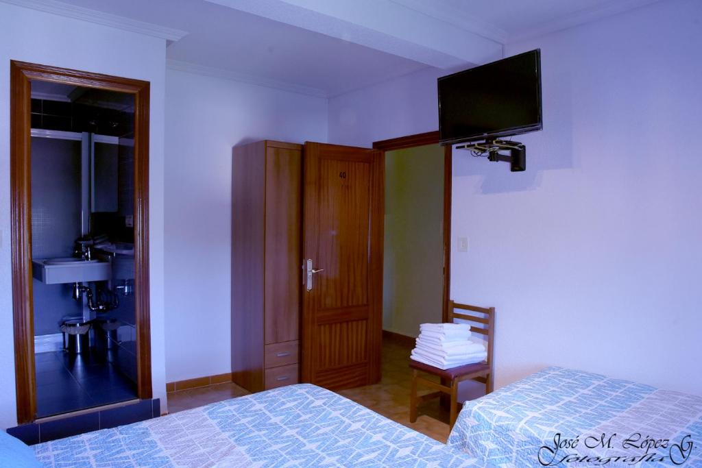 Postel nebo postele na pokoji v ubytování Hostal Restaurante El Final