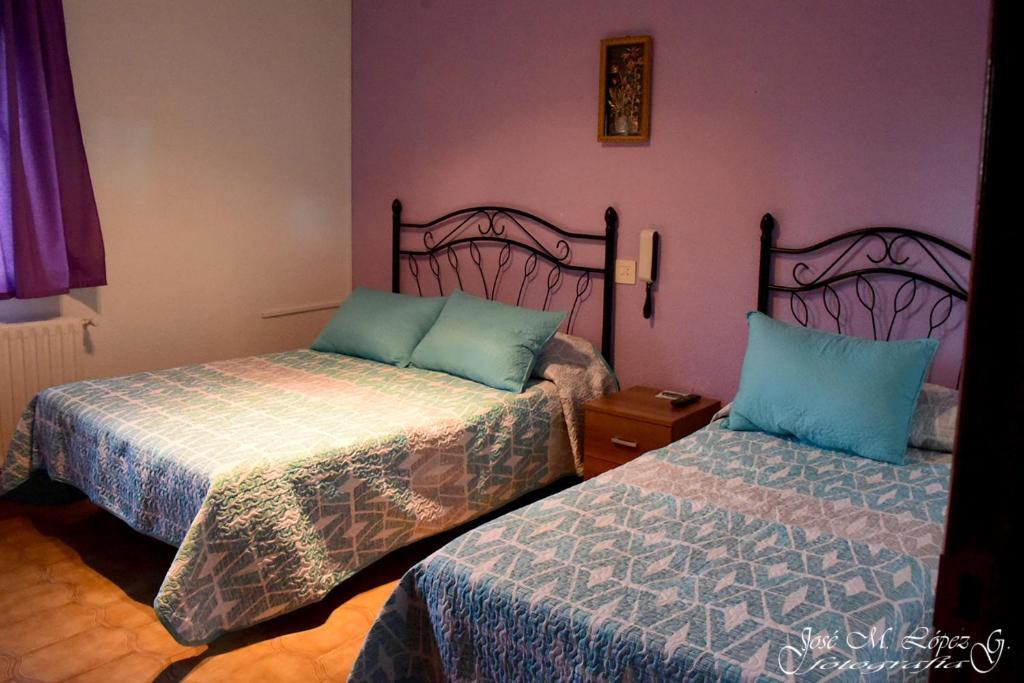 Postel nebo postele na pokoji v ubytování Hostal Restaurante El Final