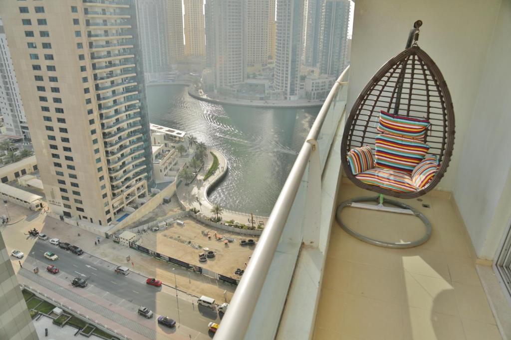 a chair sitting on the ledge of a building at Marina BestView coral in Dubai