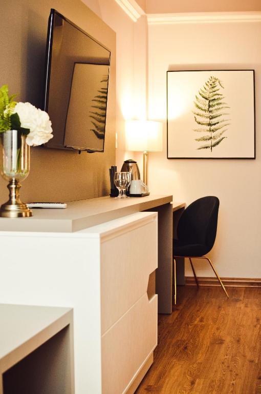 TV a/nebo společenská místnost v ubytování Bisinii Boutique Hotel