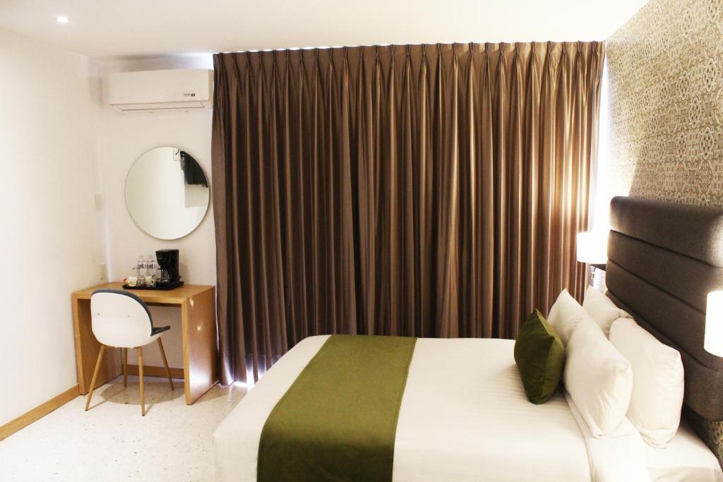 Postel nebo postele na pokoji v ubytování Hotel Ros Gaud